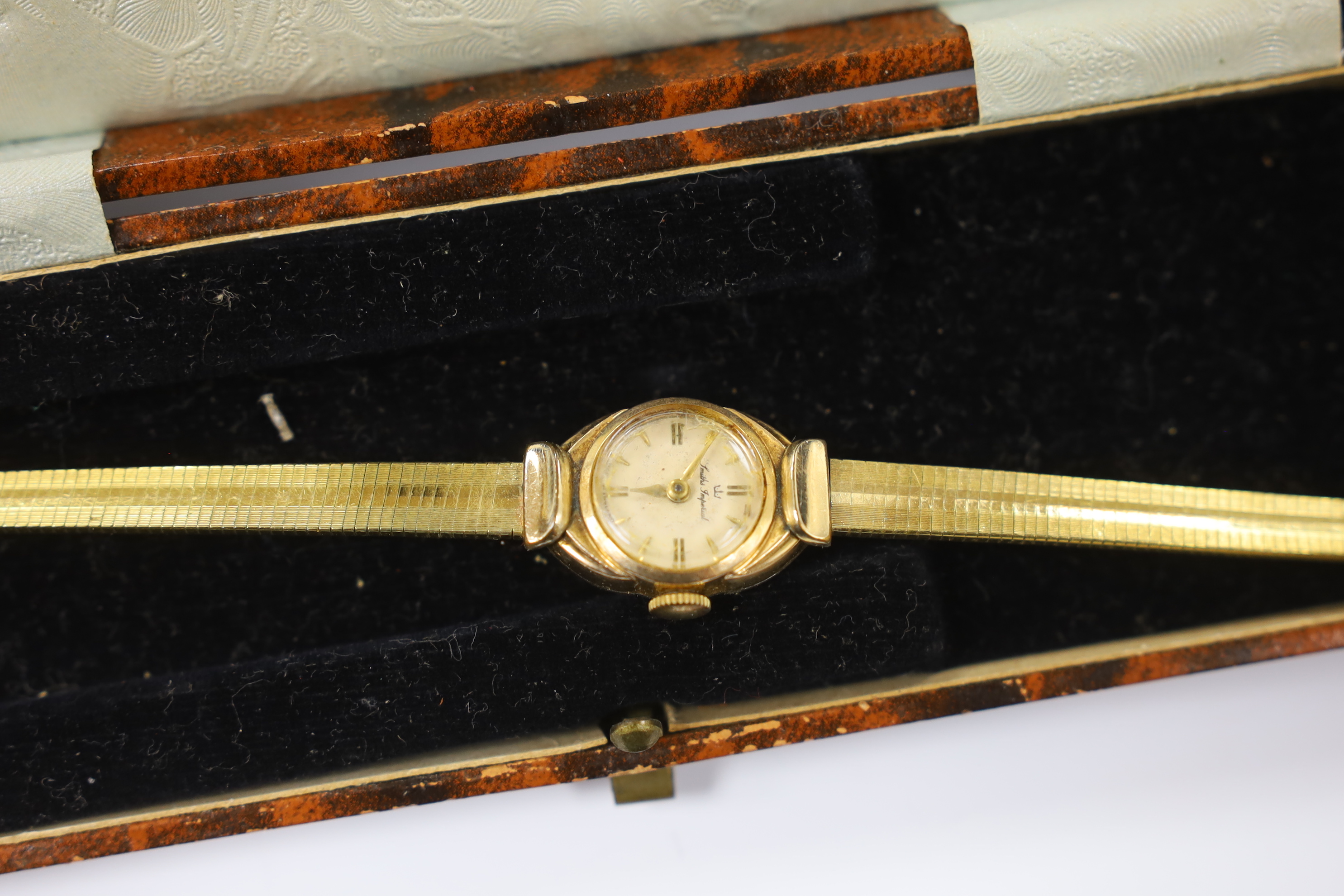 A gentleman's Raymond Weil 18k gold plated quartz dress wrist watch, a similar Bulova steel and gold plated quartz wrist watch and a lady's Smiths Imperial gold plated wrist watch.